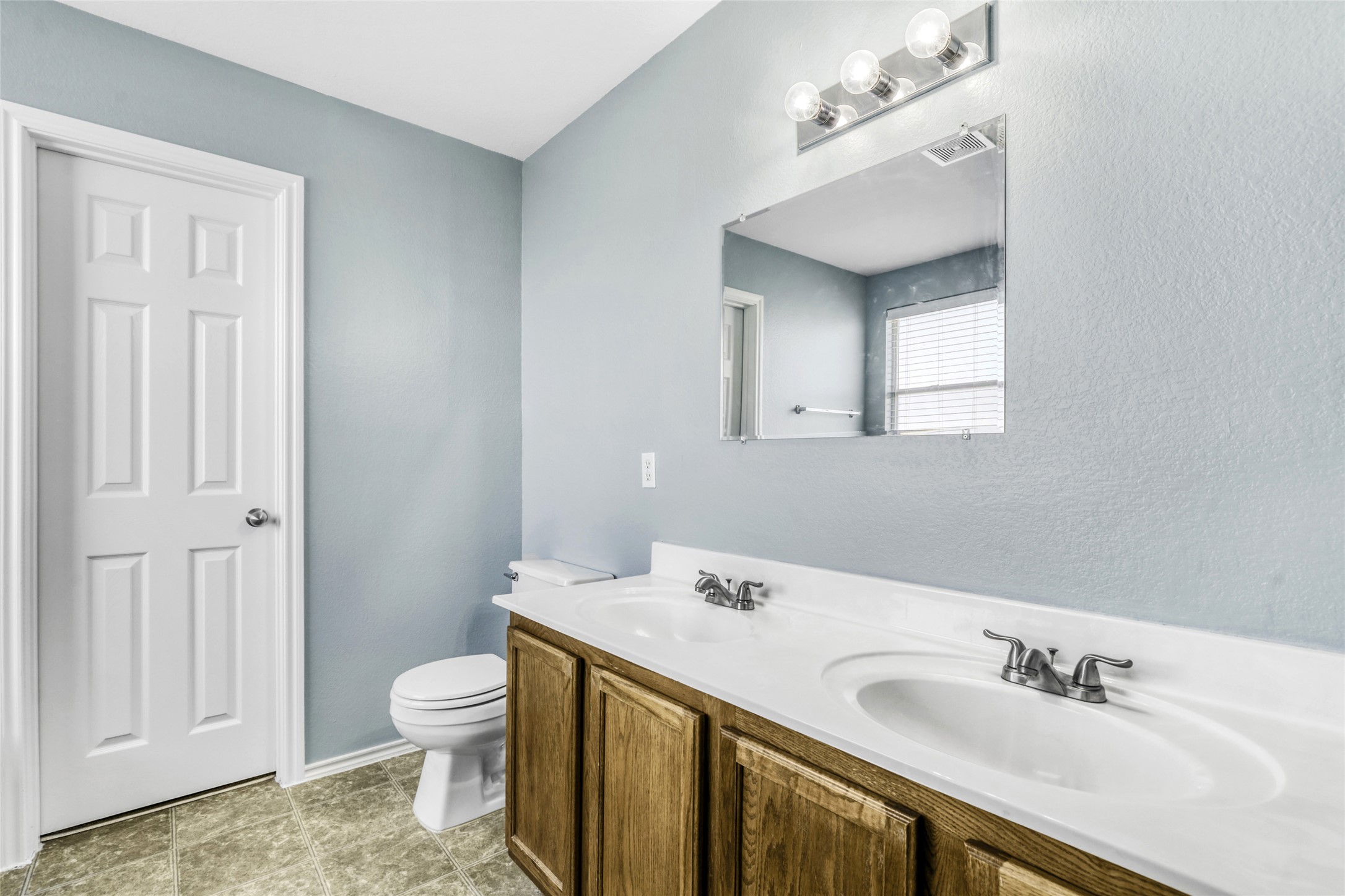 5624 Colinton Avenue Austin, TX 78754 - Photo 26 of 38 Primary Bathroom featuring double vanity