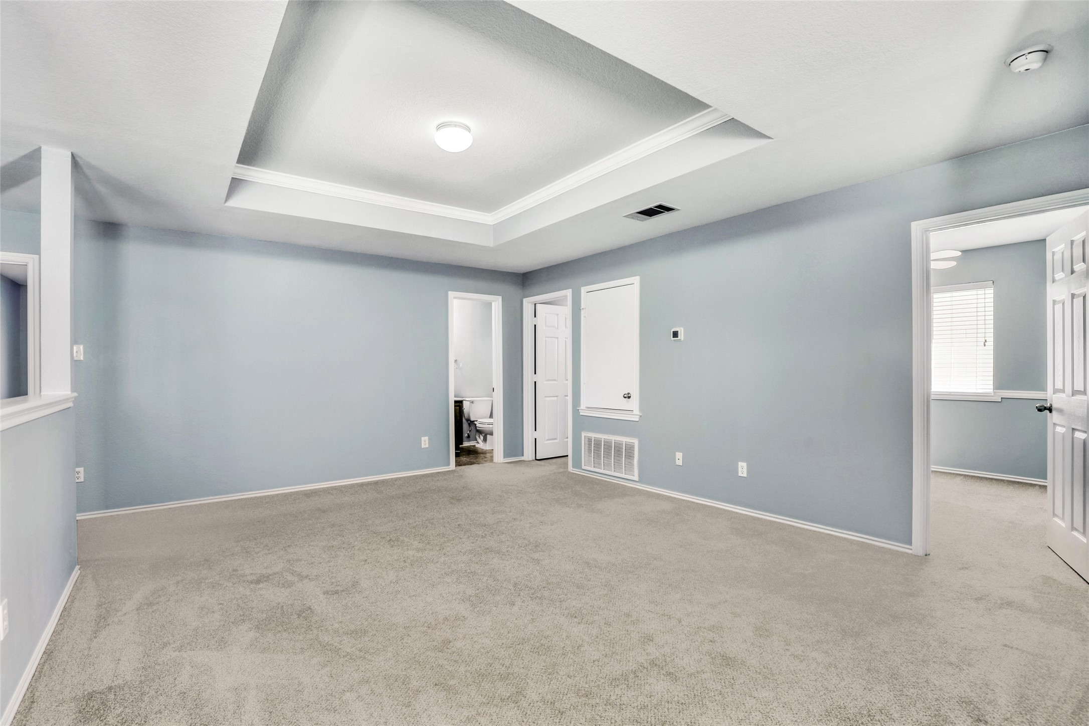 5624 Colinton Avenue Austin, TX 78754 - Photo 5 of 38 Large Upstairs Family Room with carpet, ornamental molding, and a tray ceiling