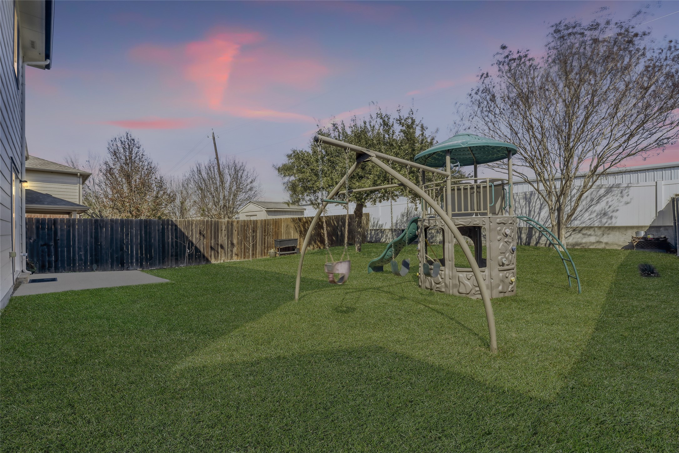 5624 Colinton Avenue Austin, TX 78754 - Photo 7 of 38 Fenced backyard with a playground and a patio area