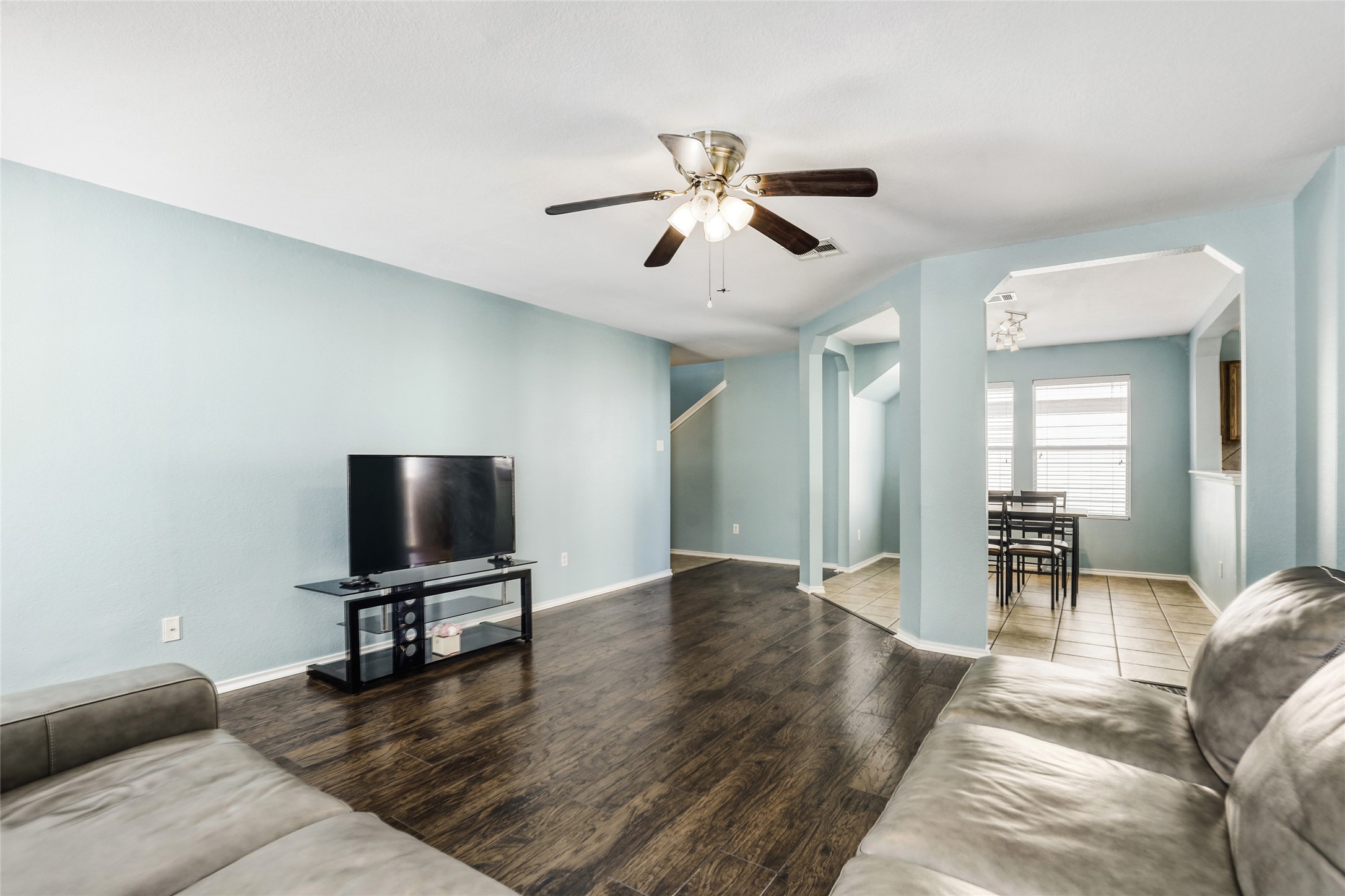 5624 Colinton Avenue Austin, TX 78754 - Photo 8 of 38 Living area with wood finished floors, a ceiling fan, and arched walkways