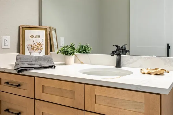 a white toilet sitting next to a bathroom sink