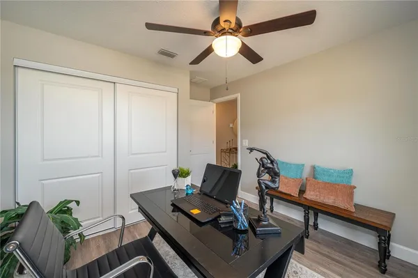 a living room with chairs and a table