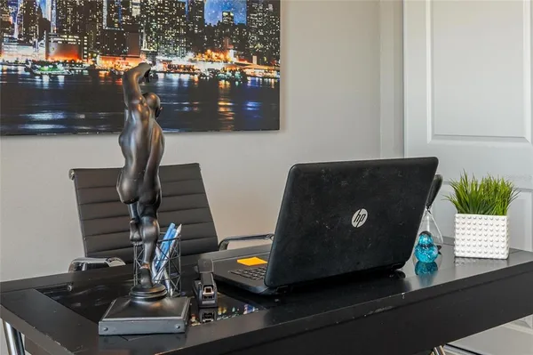 a view of a workspace with furniture