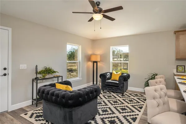 a living room with furniture and a window