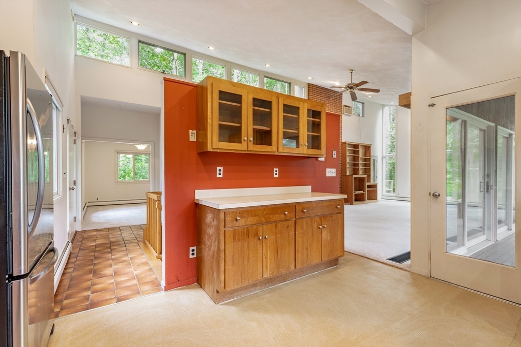 738 Lowell Road Groton, MA 01450 - Photo 11 of 30 a kitchen with stainless steel appliances granite countertop a refrigerator and a sink