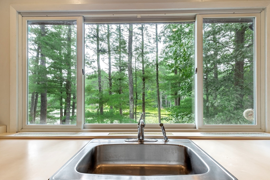 738 Lowell Road Groton, MA 01450 - Photo 12 of 30 a kitchen sink sitting in a middle next to a window