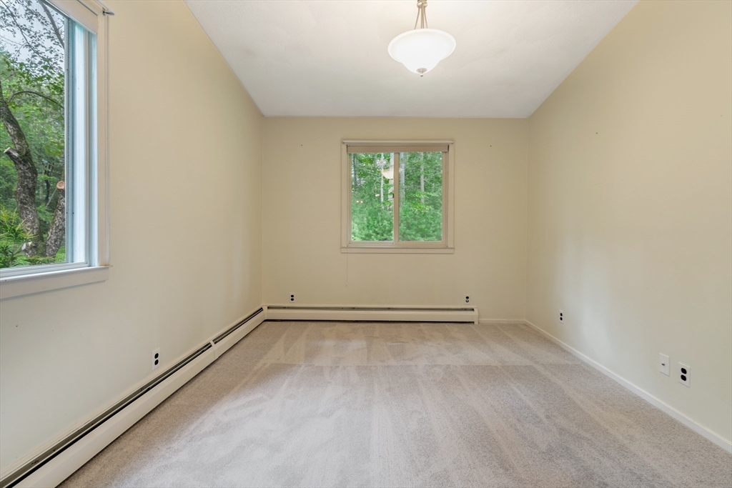 738 Lowell Road Groton, MA 01450 - Photo 13 of 30 an empty room with a empty space and windows