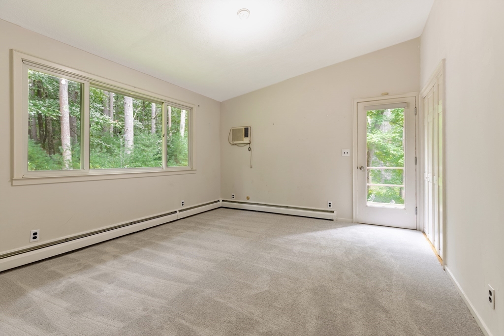 738 Lowell Road Groton, MA 01450 - Photo 14 of 30 a view of an empty room with a window