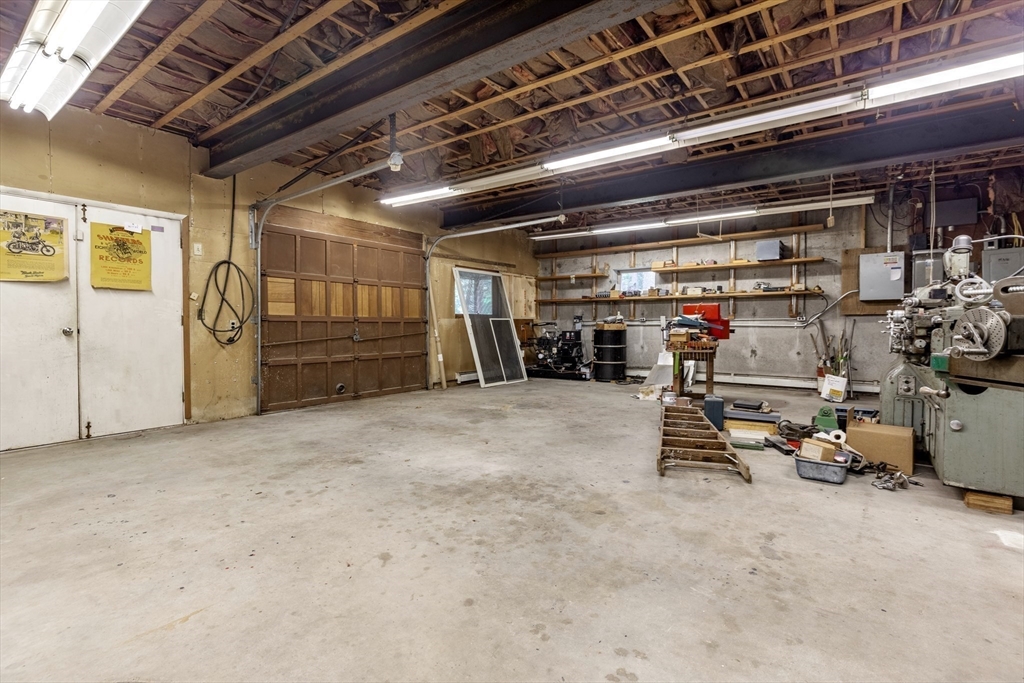 738 Lowell Road Groton, MA 01450 - Photo 19 of 30 a view of garage with gym equipment