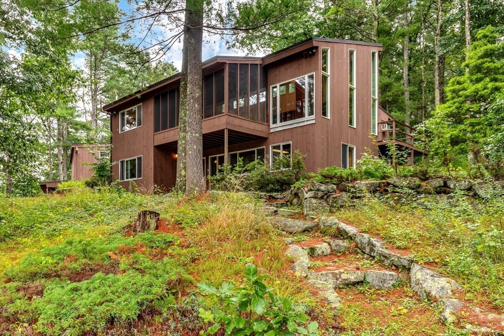 738 Lowell Road Groton, MA 01450 - Photo 2 of 30 a front view of a house with garden