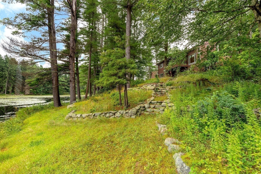 738 Lowell Road Groton, MA 01450 - Photo 23 of 30 a view of a yard with swimming pool