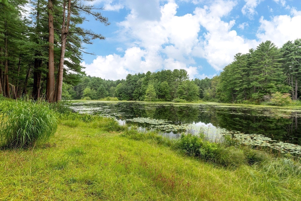 738 Lowell Road Groton, MA 01450 - Photo 3 of 30 a view of lake with green space