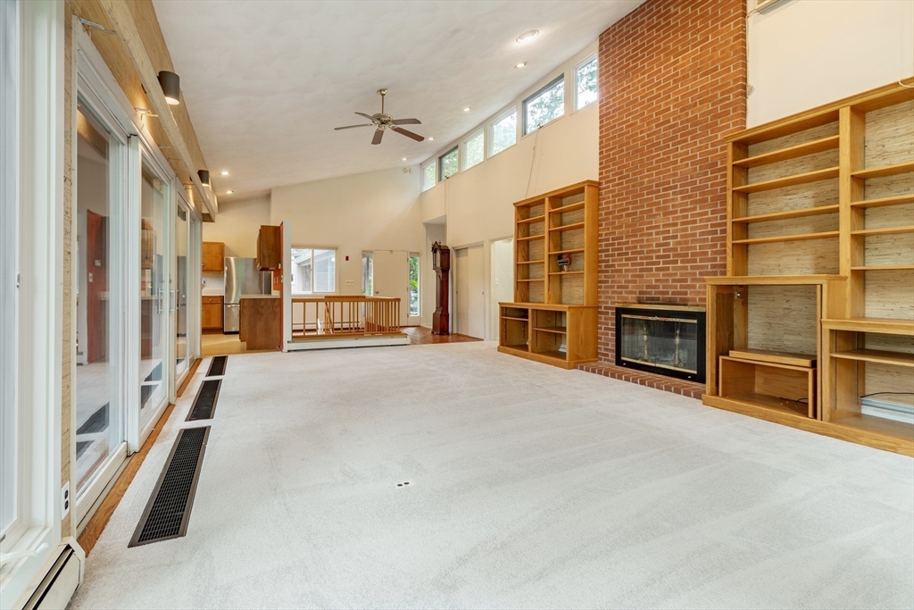 738 Lowell Road Groton, MA 01450 - Photo 6 of 30 a view of a livingroom with a fireplace
