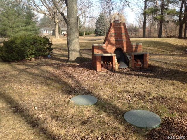 15748 Almont Road Allenton, MI 48002 - Photo 27 of 28 Outdoor Fireplace