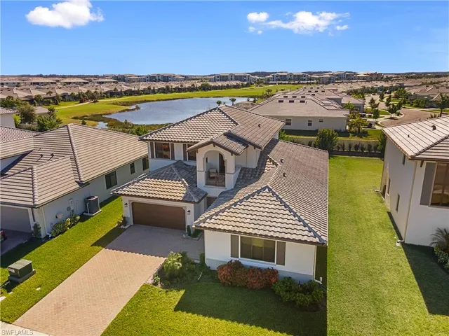 a aerial view of a house with a ocean view