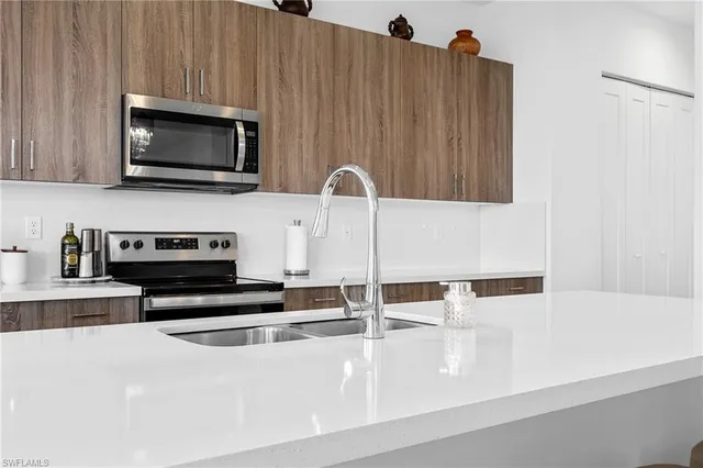 a very nice looking kitchen with a large window