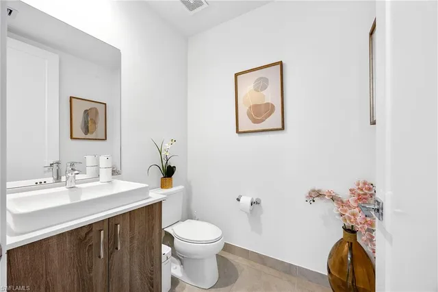 a vase of flowers sitting on a table