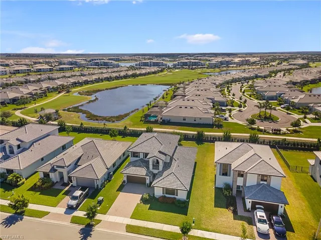 an aerial view of a house with a big yard