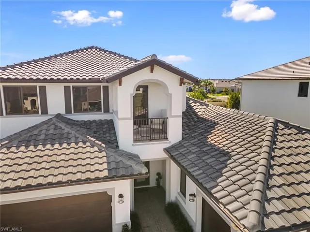 a aerial view of a house next to a big yard