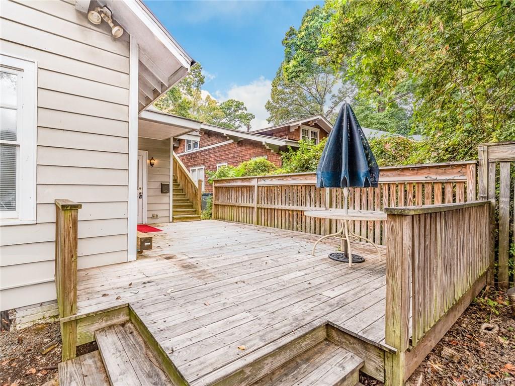2143 Park Road Charlotte, NC 28203 - Photo 22 of 22 a view of a balcony with wooden floor and fence