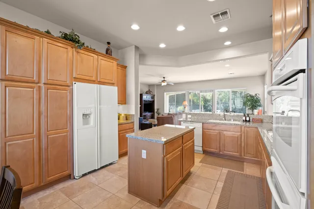 a view of a kitchen with refrigerator and washer