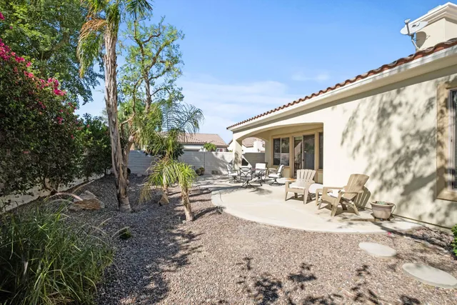 a view of a backyard with sitting area