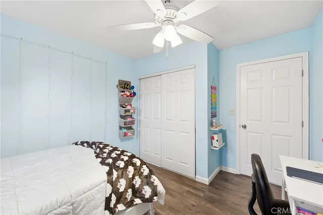 a bedroom with a bed and a chair