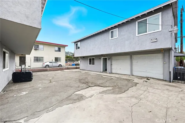 a view of a house with a yard and garage