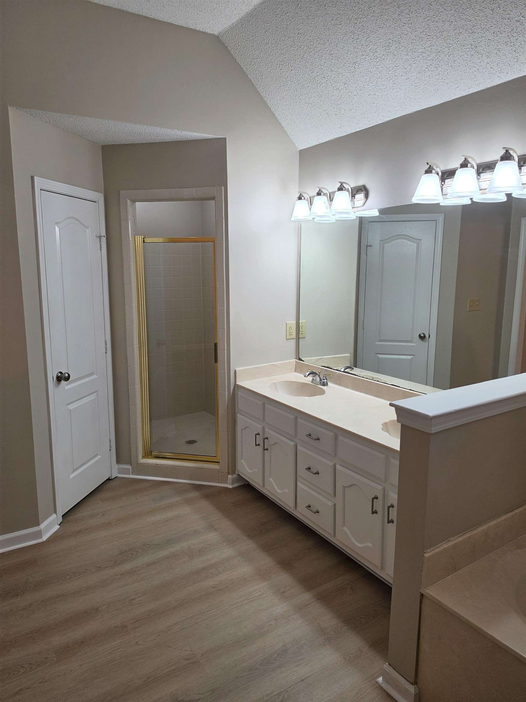 5570 Patsy Circle West Memphis, TN 38125 - Photo 14 of 22 Full bathroom featuring double vanity, light wood-style floors, a shower stall, and a garden tub