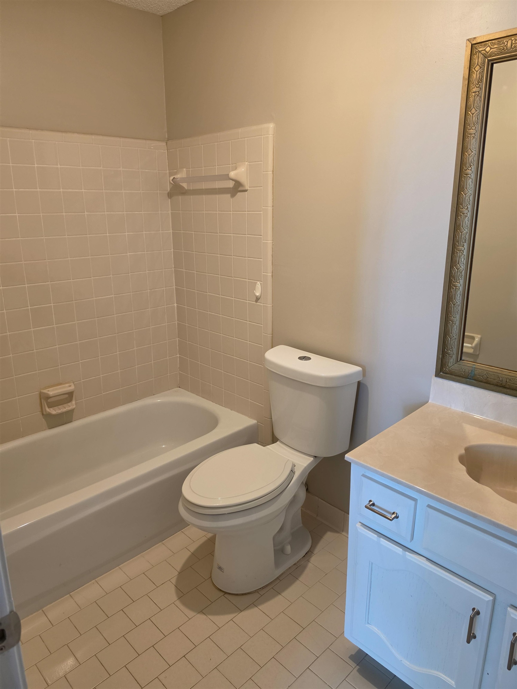 5570 Patsy Circle West Memphis, TN 38125 - Photo 20 of 22 Bathroom featuring vanity, shower / bath combination, and light tile patterned flooring