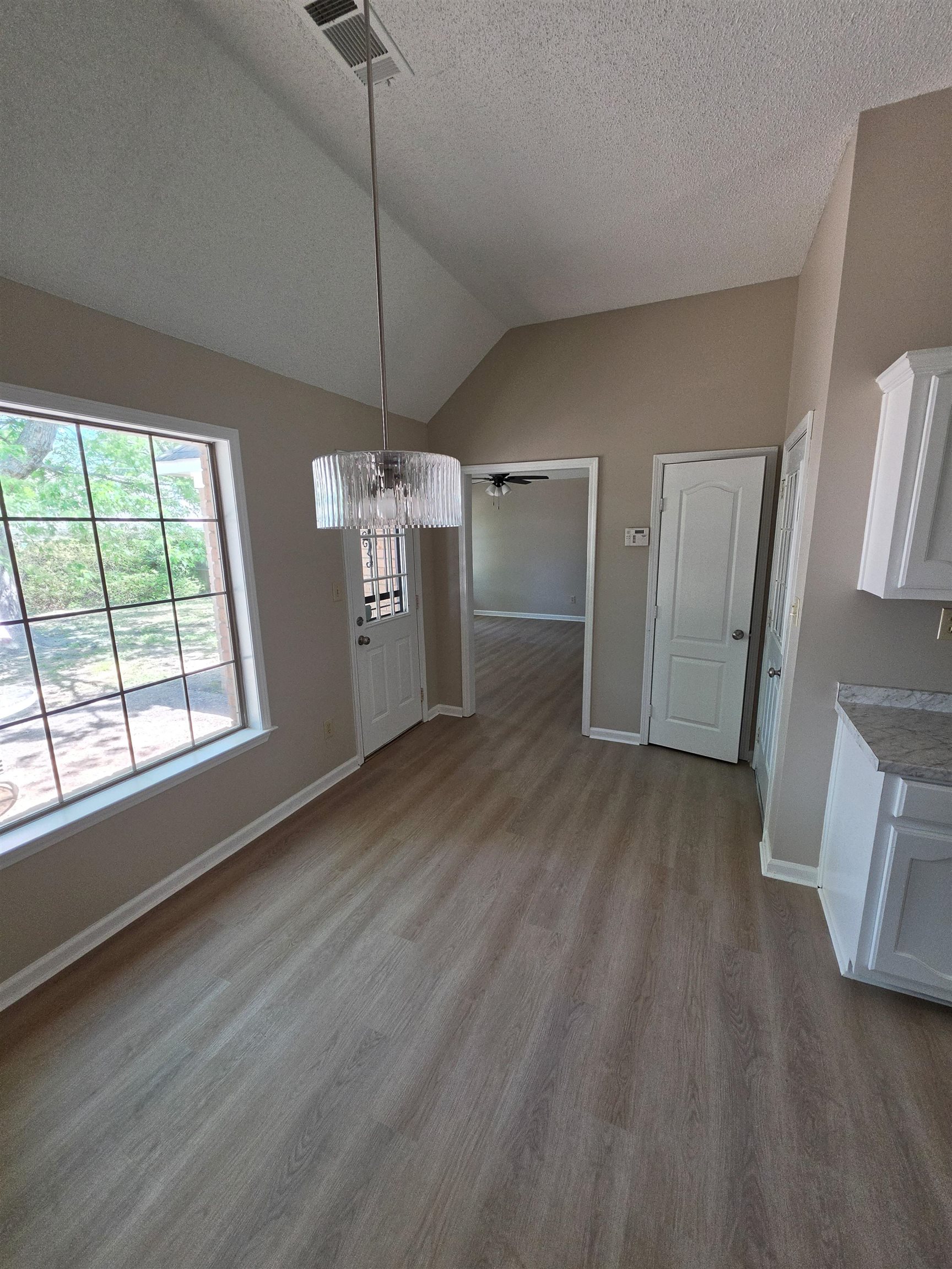 5570 Patsy Circle West Memphis, TN 38125 - Photo 10 of 22 Breakfast Room area featuring a chandelier, ceiling fan, and dark wood finished floors