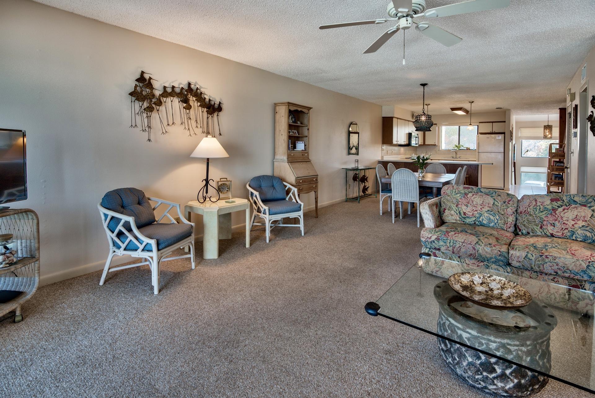 214 Blue Mountain Road, Unit 122 Santa Rosa Beach, FL 32459 - Photo 11 of 32 a living room with furniture and a chandelier