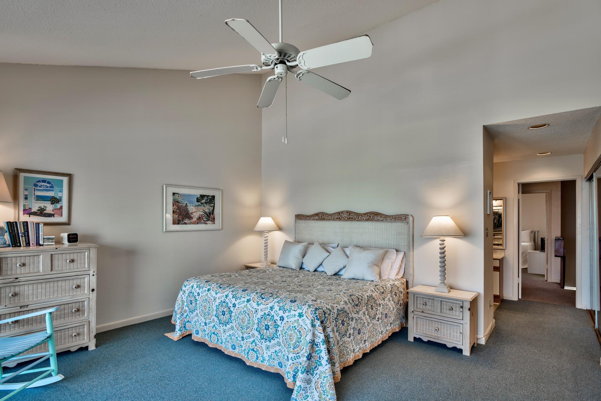 214 Blue Mountain Road, Unit 122 Santa Rosa Beach, FL 32459 - Photo 19 of 32 a bedroom with a bed and a chandelier