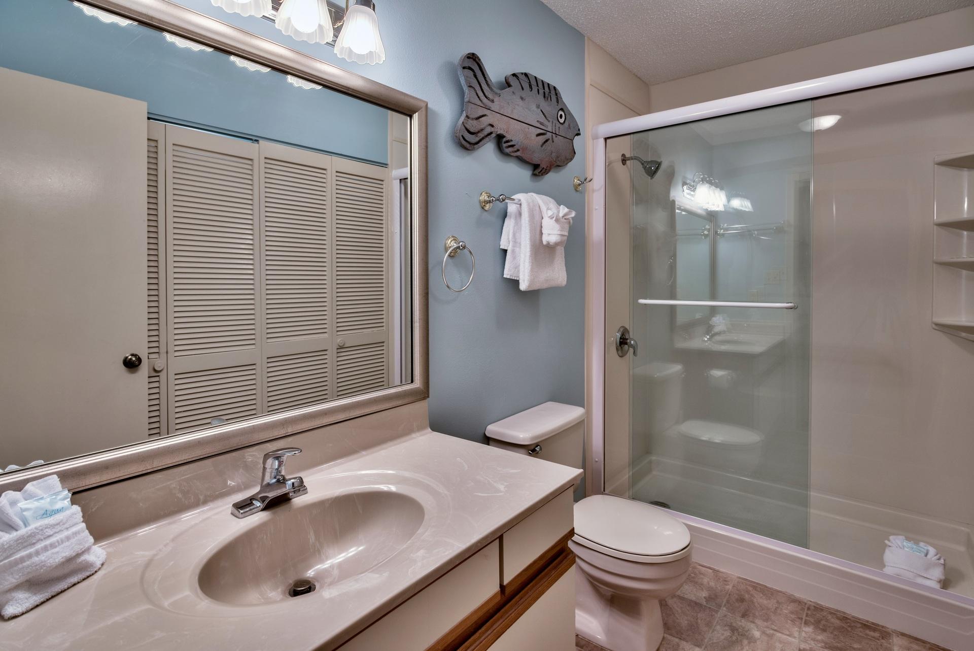 214 Blue Mountain Road, Unit 122 Santa Rosa Beach, FL 32459 - Photo 26 of 32 a bathroom with a sink toilet and shower
