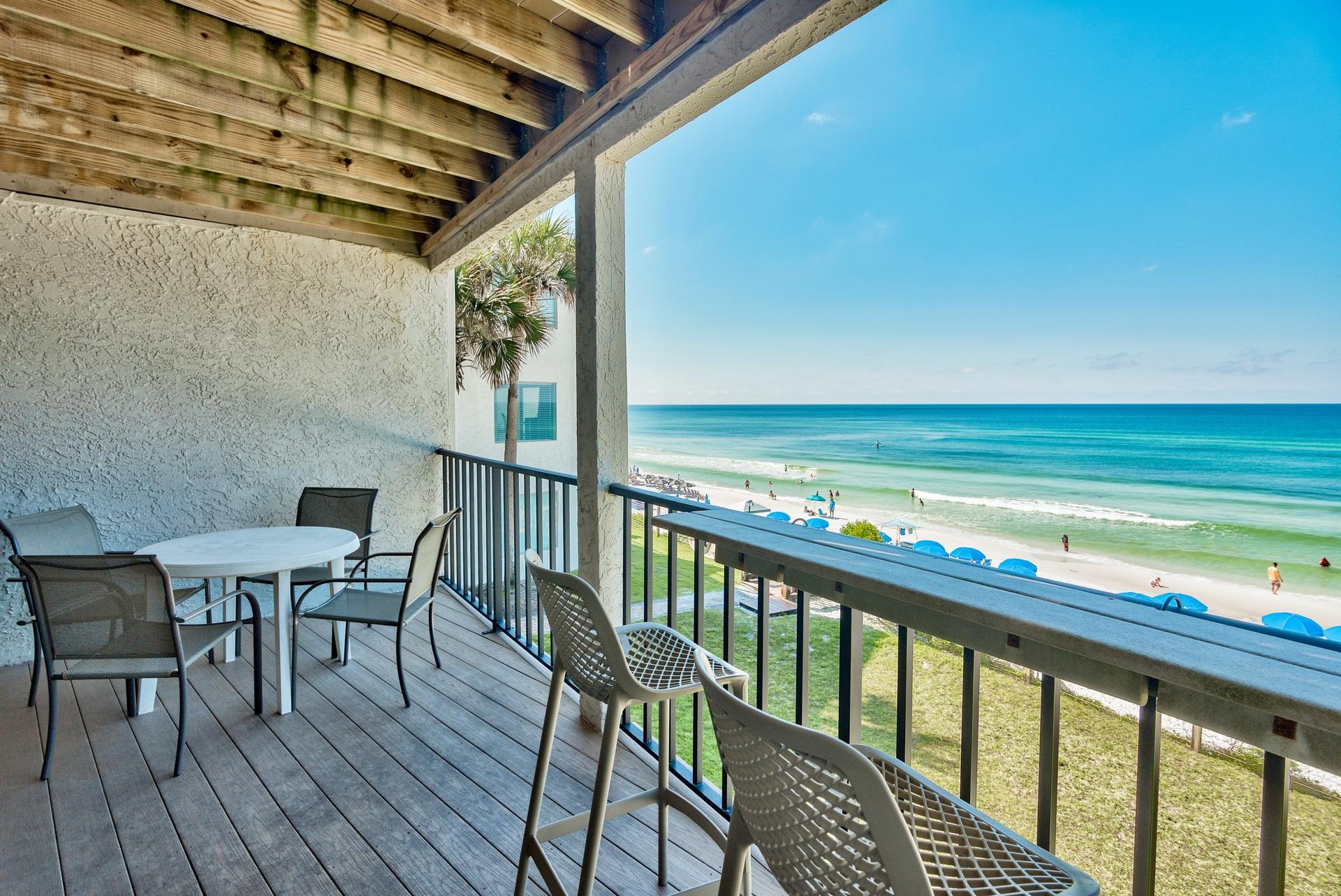 214 Blue Mountain Road, Unit 122 Santa Rosa Beach, FL 32459 - Photo 7 of 32 a view of a chairs and table on the deck