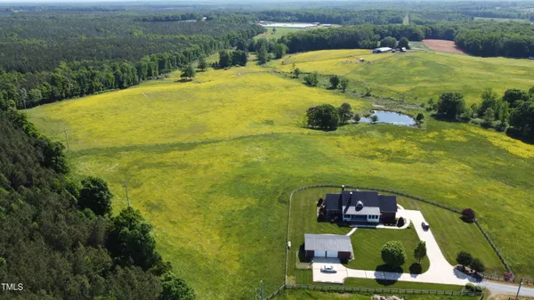 a view of a lake with a yard