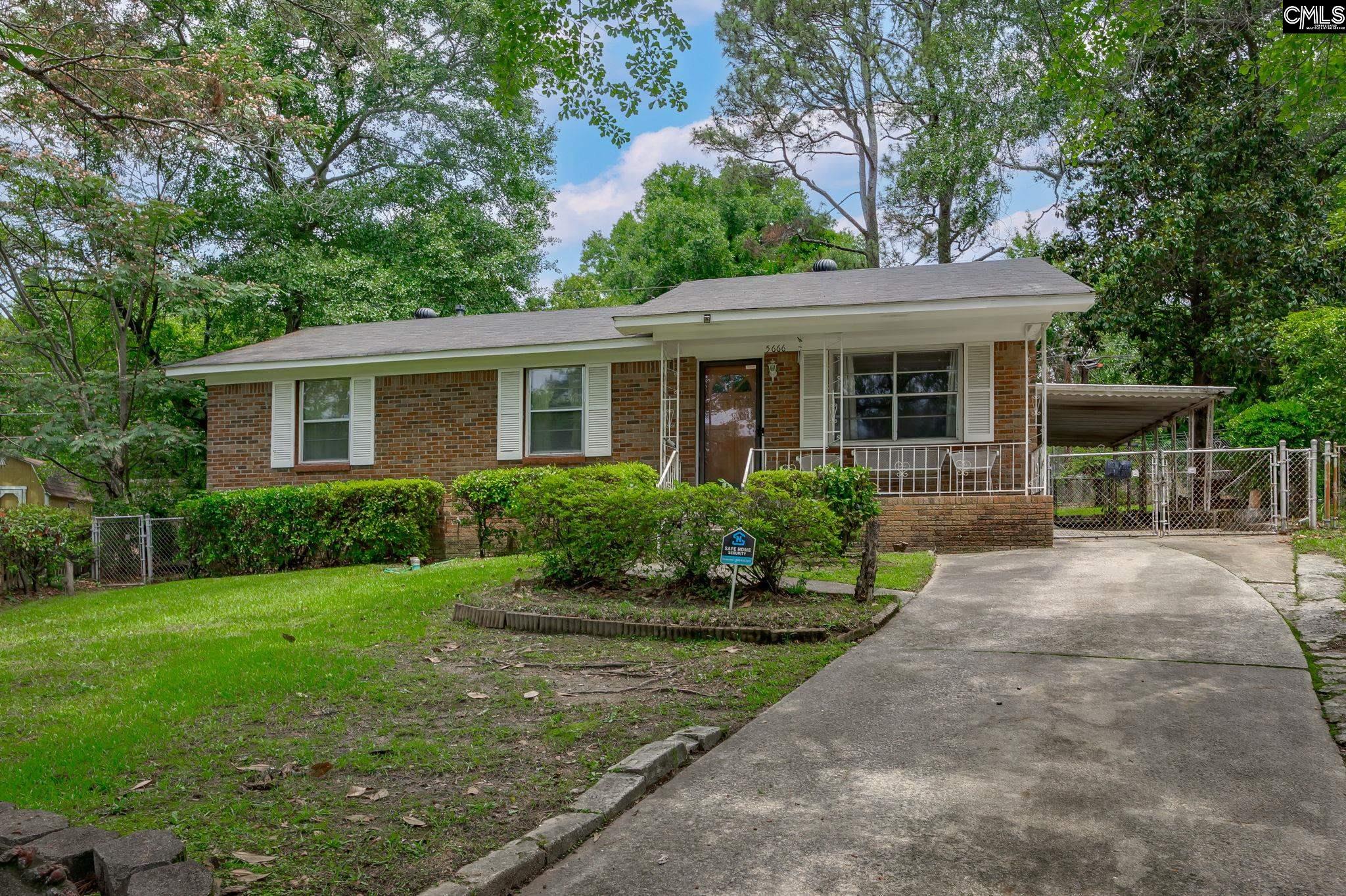 5666 Middleton Court Columbia, SC 29203 - Photo 3 of 42 a view of a house with yard and plants