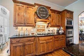 802 Pathview Court Dacula, GA 30019 - Photo 19 of 56 a kitchen with granite countertop a sink and a stove