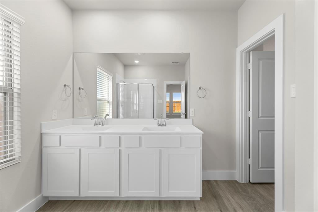 2372 Bell Way Forney, TX 75126 - Photo 32 of 39 a spacious bathroom with a mirror and a sink
