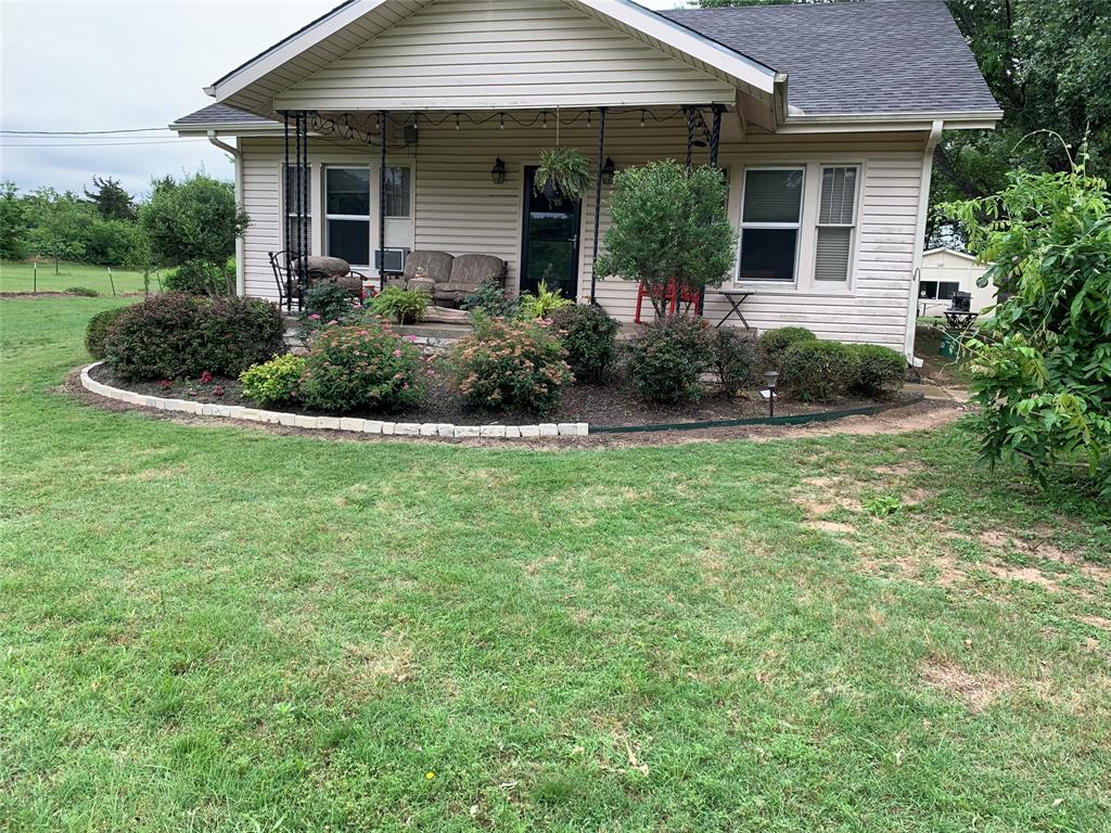 2330 Knight Road Denison, TX 75020 - Photo 2 of 14 a front view of a house with a yard