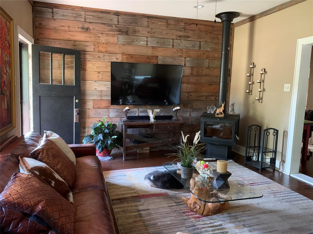 2330 Knight Road Denison, TX 75020 - Photo 3 of 14 a living room with furniture and a flat screen tv