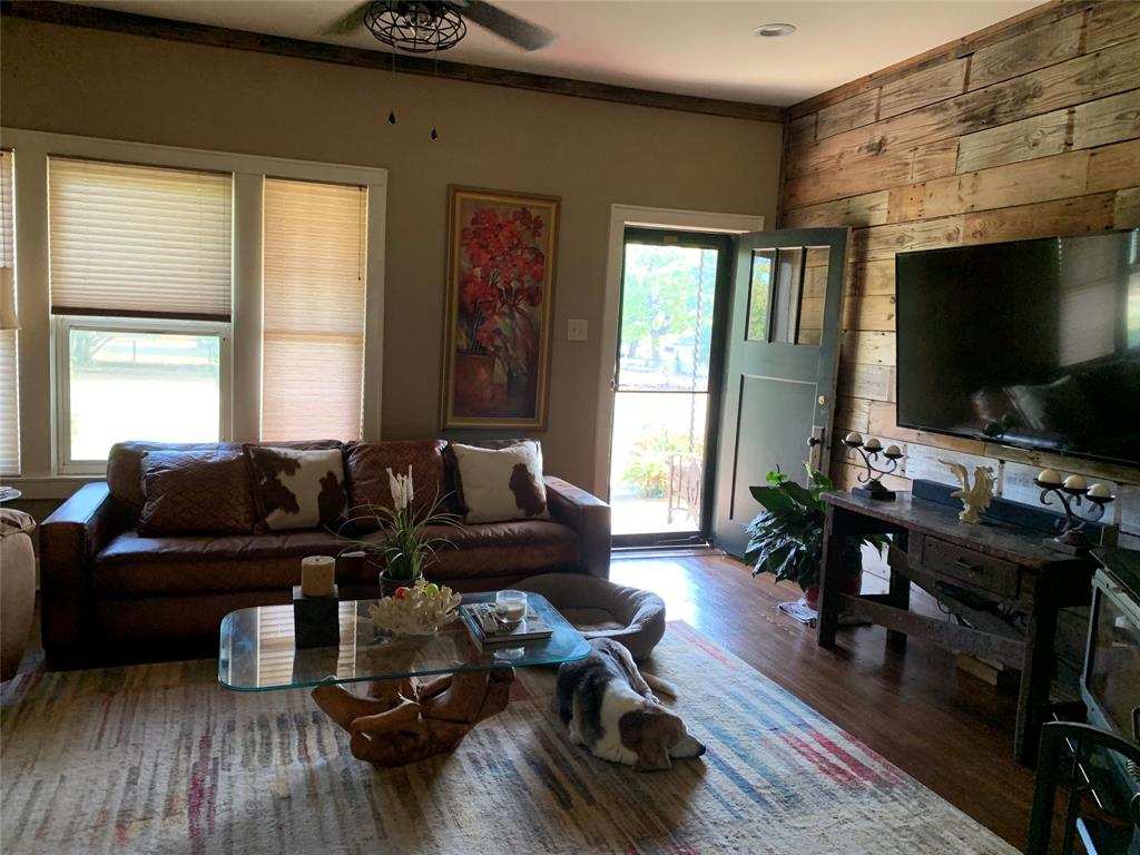 2330 Knight Road Denison, TX 75020 - Photo 5 of 14 a living room with furniture and a flat screen tv