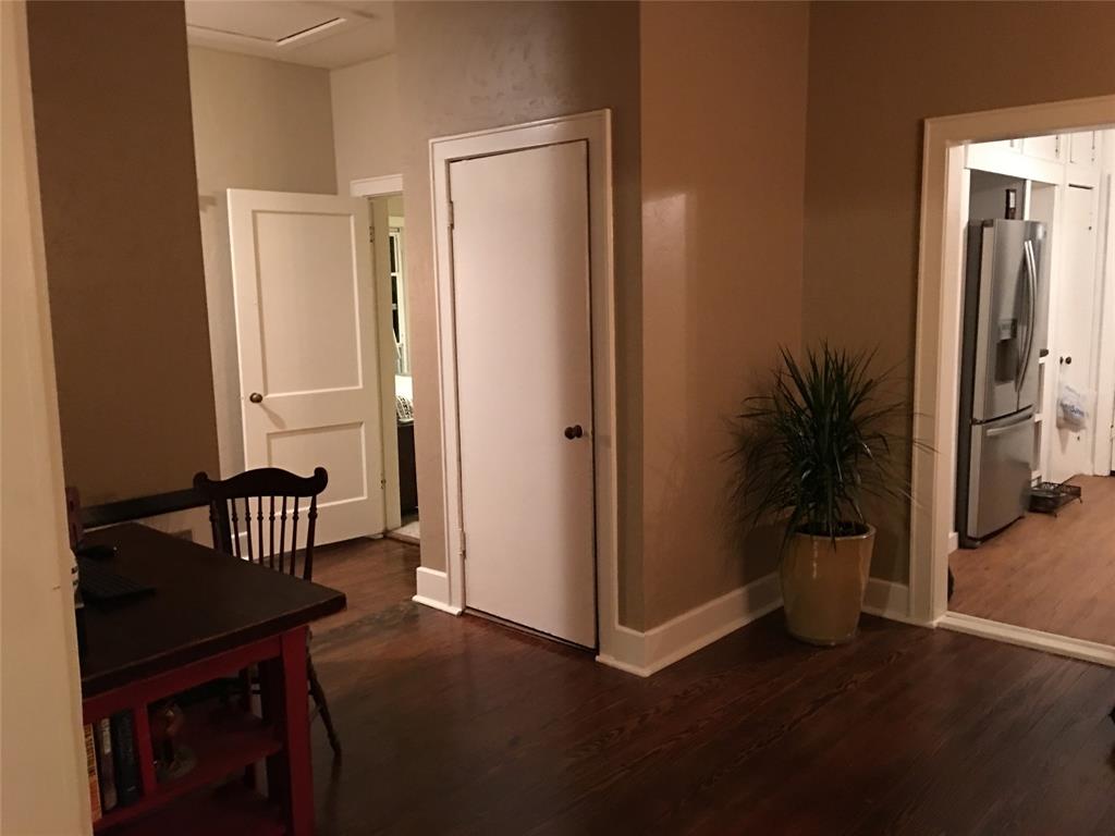2330 Knight Road Denison, TX 75020 - Photo 9 of 14 an empty room with wooden floor and a potted plant