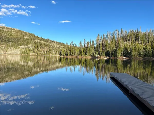 a view of lake with green space