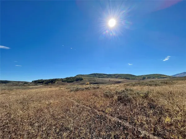 a view of mountain and an ocean