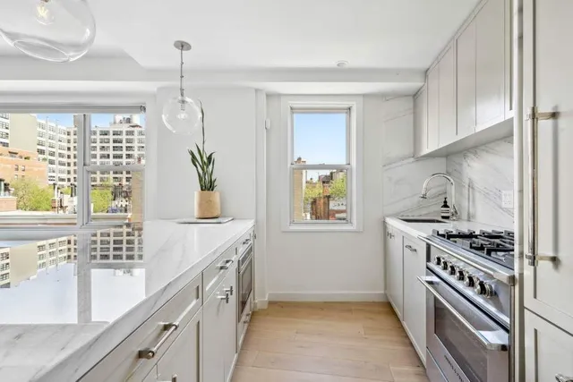 a view of a a dining room with furniture window and wooden floor