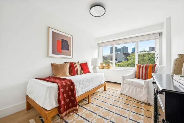 a bathroom with a sink a toilet a mirror and shower