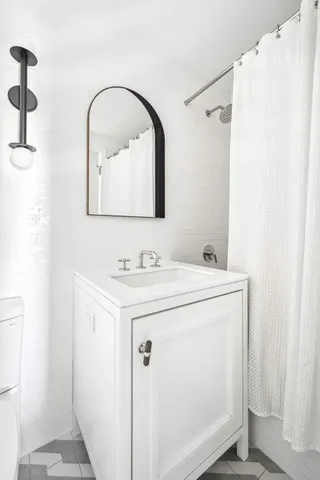 a bedroom with a bed and a couch