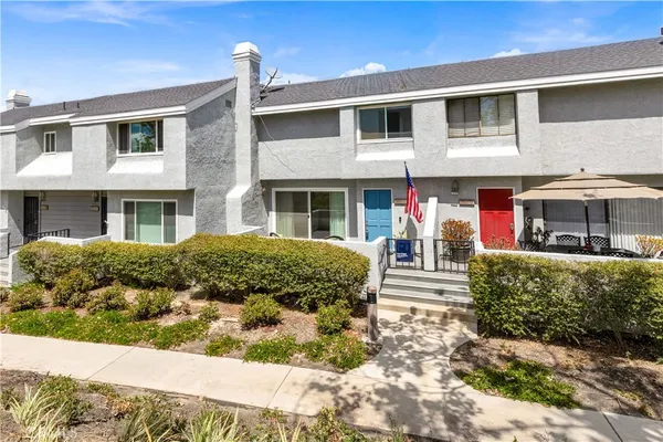 a kitchen with stainless steel appliances granite countertop a stove top oven a sink a counter top space cabinets and stainless steel appliances
