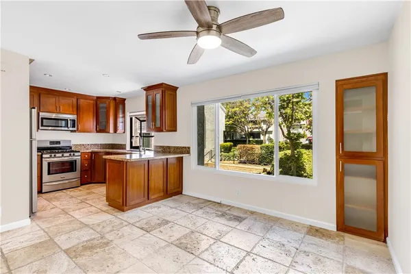 a kitchen with granite countertop a sink and a window
